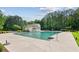 Large community pool with ample deck space, perfect for summer relaxation and neighborhood gatherings at 7020 Weybridge Dr, Cumming, GA 30040