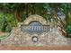 Stone community entrance sign with 'Sheffield' nameplate, exuding a welcoming and established neighborhood feel at 7020 Weybridge Dr, Cumming, GA 30040