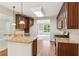 Traditional kitchen features granite counters, stainless steel appliances, and wooden cabinetry at 7020 Weybridge Dr, Cumming, GA 30040