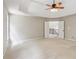 Open main bedroom with a trey ceiling, ceiling fan, big windows, and a dual door entry at 7020 Weybridge Dr, Cumming, GA 30040