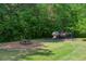 Community playground featuring a play structure, picnic table, and open green space for children to enjoy at 7020 Weybridge Dr, Cumming, GA 30040