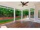 Enjoy this outdoor space with a covered porch and views of the treelined backyard at 7020 Weybridge Dr, Cumming, GA 30040