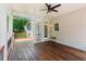 Relax on the porch with a view of the well-maintained backyard and the side of the home at 7020 Weybridge Dr, Cumming, GA 30040
