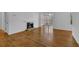 Spacious living room with laminate flooring, fireplace, and great natural light at 907 Country Park Se Dr, Smyrna, GA 30080