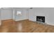 Bright living room with modern fireplace, light colored walls, and laminate wood floor at 907 Country Park Se Dr, Smyrna, GA 30080