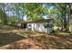 Back of the house features a covered patio, and green awning at 92 Valley Se Trl, Acworth, GA 30101
