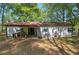Back of the house features a sliding door, and a small porch at 92 Valley Se Trl, Acworth, GA 30101