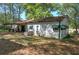 Back of the house features a covered patio, and green awning at 92 Valley Se Trl, Acworth, GA 30101