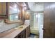 Bathroom with a yellow sink, cabinets and glass shower door at 92 Valley Se Trl, Acworth, GA 30101