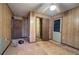Empty bedroom with wood walls and exposed subfloor, awaiting renovation at 92 Valley Se Trl, Acworth, GA 30101