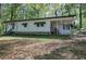Exterior of single story home with stone accents, green awnings, and covered porch at 92 Valley Se Trl, Acworth, GA 30101