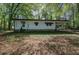Exterior view of a cozy home surrounded by lush trees at 92 Valley Se Trl, Acworth, GA 30101