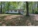 Exterior view of the home with cozy covered front porch and lush greenery at 92 Valley Se Trl, Acworth, GA 30101