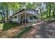 Relaxing exterior view of a home with cozy covered front porch with seating at 92 Valley Se Trl, Acworth, GA 30101