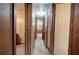 Hallway with wood paneling and closet space leading to multiple rooms at 92 Valley Se Trl, Acworth, GA 30101