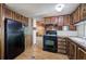 Classic kitchen featuring wood cabinets and black appliances at 92 Valley Se Trl, Acworth, GA 30101