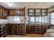 Traditional kitchen with wood cabinets, laminate countertops, and window views at 92 Valley Se Trl, Acworth, GA 30101