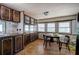 Eat-in kitchen with wood cabinets, laminate countertops, and views to yard at 92 Valley Se Trl, Acworth, GA 30101