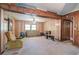 Cozy living room featuring wood paneling and neutral carpet at 92 Valley Se Trl, Acworth, GA 30101