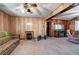 Spacious living room featuring wood-paneled walls and ample natural light at 92 Valley Se Trl, Acworth, GA 30101