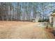 Large backyard features a storage shed and a patio perfect for relaxing at 1935 Knight Cir, Loganville, GA 30052