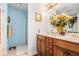 Bathroom featuring a double vanity, wood cabinets, and a walk-in shower at 1935 Knight Cir, Loganville, GA 30052