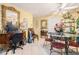 A corner of the dining area featuring a glass-top table, chairs, and decoratively framed mirror at 1935 Knight Cir, Loganville, GA 30052