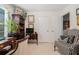 The home office features custom shelves, natural lighting, and traditional decor at 1935 Knight Cir, Loganville, GA 30052