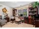 Elegant home office featuring custom bookshelves and a desk near a window at 1935 Knight Cir, Loganville, GA 30052