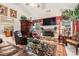 Cozy living room features a stone fireplace, vaulted ceilings, and elegant furnishings at 1935 Knight Cir, Loganville, GA 30052