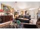 Bright living room with vaulted ceilings, a plush leather sofa, and tasteful furnishings at 1935 Knight Cir, Loganville, GA 30052
