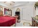 Main bedroom featuring tray ceilings, neutral walls, carpet, and a sitting area at 1935 Knight Cir, Loganville, GA 30052