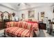 Spacious main bedroom with tray ceilings, a sitting area, and large windows at 1935 Knight Cir, Loganville, GA 30052