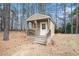 Exterior shot of a shed featuring a porch and white trim at 1935 Knight Cir, Loganville, GA 30052