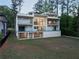 Modern home with multiple decks and lots of windows with wooded area surrounding the property at 2650 Fairoaks Rd, Decatur, GA 30033