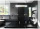 Luxurious bathroom featuring a marble shower, soaking tub, modern fixtures, and built in shelving at 2650 Fairoaks Rd, Decatur, GA 30033