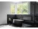 Sleek bathroom featuring marble floors, soaking tub, glass shower, and natural light from large windows at 2650 Fairoaks Rd, Decatur, GA 30033