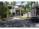Striking modern home with large windows, unique architectural details and a curved driveway at 2650 Fairoaks Rd, Decatur, GA 30033
