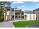 Stunning modern home with a manicured lawn, porte-cochere, and grand entrance at 2650 Fairoaks Rd, Decatur, GA 30033