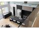 Modern kitchen featuring stone countertops, island seating, and stainless steel appliances, view from above at 2650 Fairoaks Rd, Decatur, GA 30033