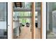 Bright, open-concept living room with floor-to-ceiling windows and modern finishes, offers natural light and stunning views at 2650 Fairoaks Rd, Decatur, GA 30033