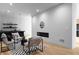 Bright living room with modern fireplace, wet bar, and seating area, perfect for entertaining guests at 2650 Fairoaks Rd, Decatur, GA 30033