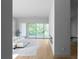 Bright main bedroom with a sliding glass door leading to a deck with wooded views at 2650 Fairoaks Rd, Decatur, GA 30033