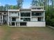 Modern home with multiple balconies and large glass doors, offering seamless indoor/outdoor living at 2650 Fairoaks Rd, Decatur, GA 30033