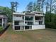 Modern home with multiple balconies and large glass doors for seamless indoor-outdoor living at 2650 Fairoaks Rd, Decatur, GA 30033