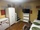 Finished basement with a freezer, dining area, and access to the stairs at 350 Spring View Ct, Dallas, GA 30157
