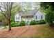 Well-kept home with lush landscaping, a sloped lawn, and inviting porch at 350 Spring View Ct, Dallas, GA 30157