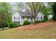 Lovely home with meticulous landscaping, beautiful lawn, and cozy front porch at 350 Spring View Ct, Dallas, GA 30157