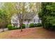 Street view of the house with a sloped front yard and landscaping at 350 Spring View Ct, Dallas, GA 30157