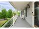 Side view of a lovely front porch with seating and railing at 350 Spring View Ct, Dallas, GA 30157